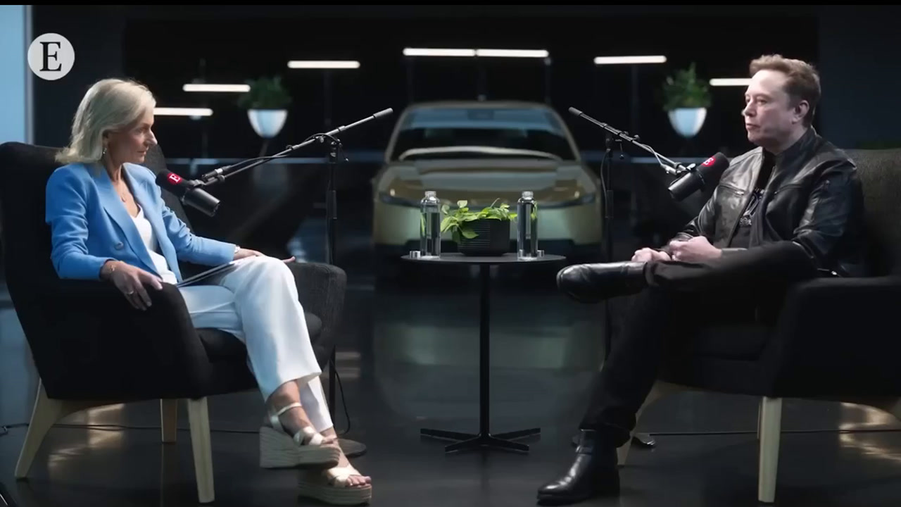 Wide interview shot showing both speakers seated apart